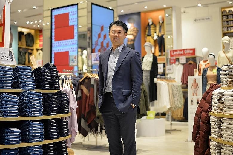 Mr Yuki Yamada, chief executive for Uniqlo Singapore and Malaysia, at the Japanese clothes retailer's flagship outlet in Orchard Central. The company is opening a new store soon, adding to its 28 outlets here.