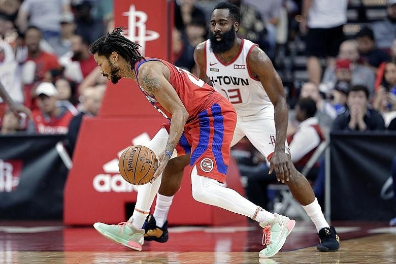Detroit's Derrick Rose driving around Houston's James Harden, as he came off the bench to score 10 of his 20 points in the final 12 minutes to help the visiting Pistons outlast the Rockets 115-107.
