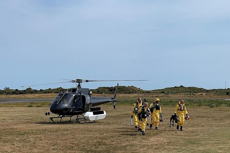 A police search and rescue team returning to New Zealand's Whakatane Airport yesterday after searching for bodies following the eruption of the White Island volcano last Monday. PHOTO: REUTERS