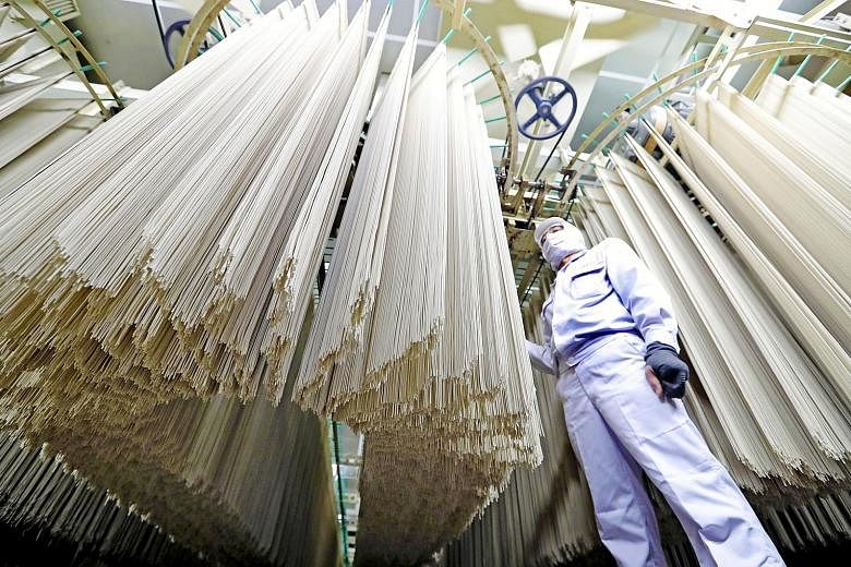Freshly made soba noodles hanging from racks at a soba factory in Shintoku, Japan. The country's decline in manufacturing poses a growing headache for policymakers counting on robust demand at home to prop up slowing growth, with consumer spending ta