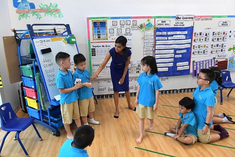 Left: A class at an MOE-run kindergarten in Punggol. By around 2025, eight in 10 young children should have a place in more affordable government-supported pre-schools. ST FILE PHOTO KidStart home visitor Lee Wei Qi with 19-month-old Ae'dan Raphael a
