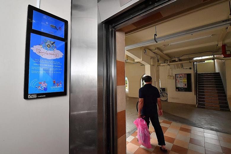 Target Media Culcreative will install and operate 6,000 new digital display panels in Housing Board blocks, similar to this one in a Tampines lift. The screens will display public health advisories, news updates and more.