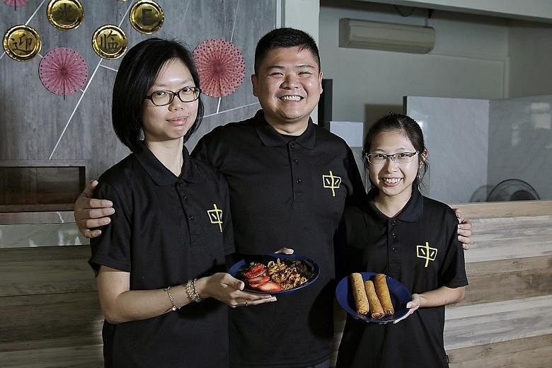 Mummy Yummy staff who are also family members of the founders, (from far left) Ms Cheng Yihui, 28, Mr Chan Guo Xiong, 35, and Ms Ang Hwee Shi, 25, with dishes they serve at their vegetarian restaurant at 20 Jalan Pari Burong in Bedok.