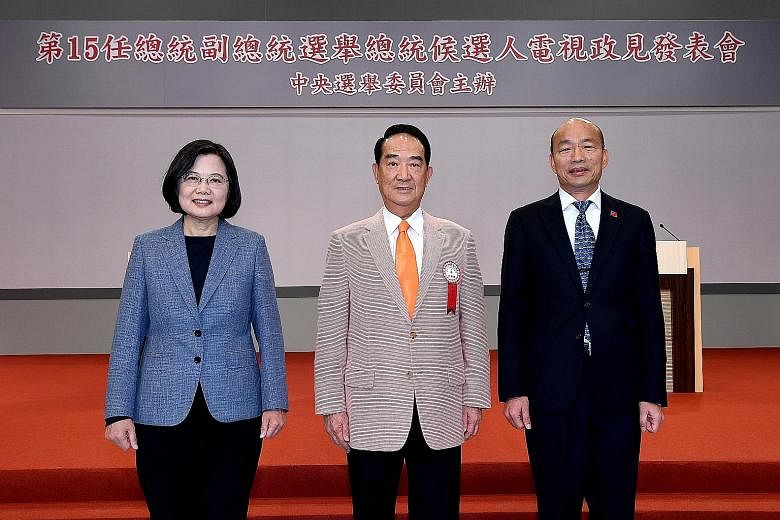 From left: President Tsai Ing-wen, Mr James Soong and Mr Han Kuo-yu before a live televised pre-election policy address yesterday by the three candidates in Taiwan's presidential polls next year. PHOTO: EPA-EFE