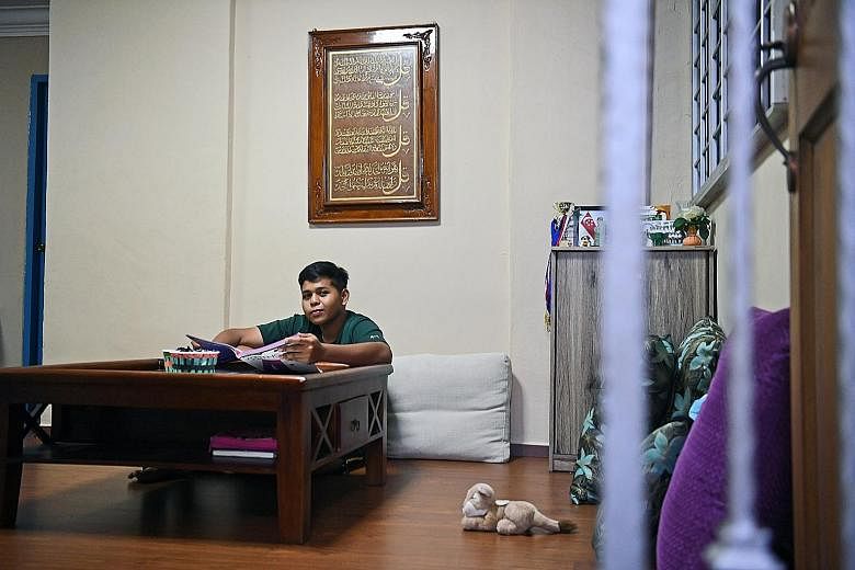 Crest Secondary School student Muhammad Hairul' Raziqin Efendi has had to work part-time to help his family while studying for the N levels. ST PHOTO: DESMOND FOO SEE HOME B2