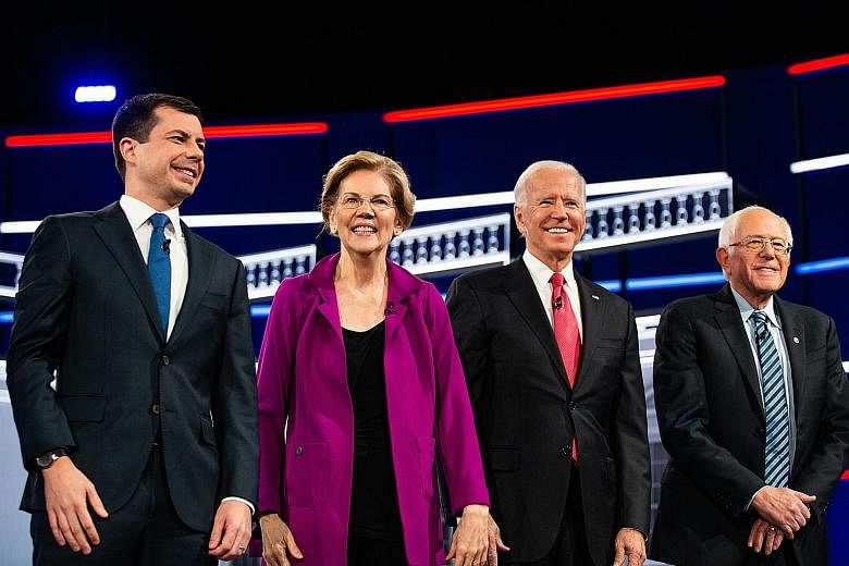 The Democrats aiming to unseat President Donald Trump include (from left) Pete Buttigieg, Elizabeth Warren, Joe Biden and Bernie Sanders. The writer says that with the election approaching, none of the leading candidates shows much promise of uniting
