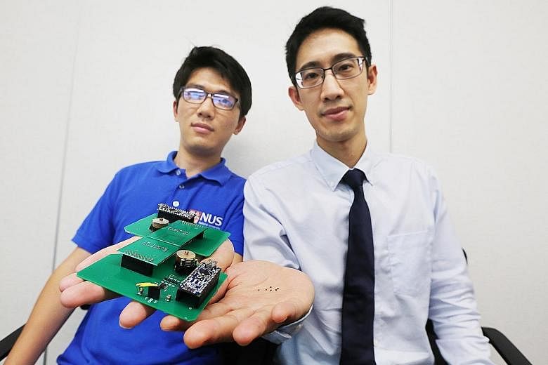 Left: National University of Singapore Assistant Professor John Ho (in white shirt) and PhD student Dong Zhenya with a prototype of the wireless reader their team created to easily read signals from microsensors less than 1mm long. They also develope