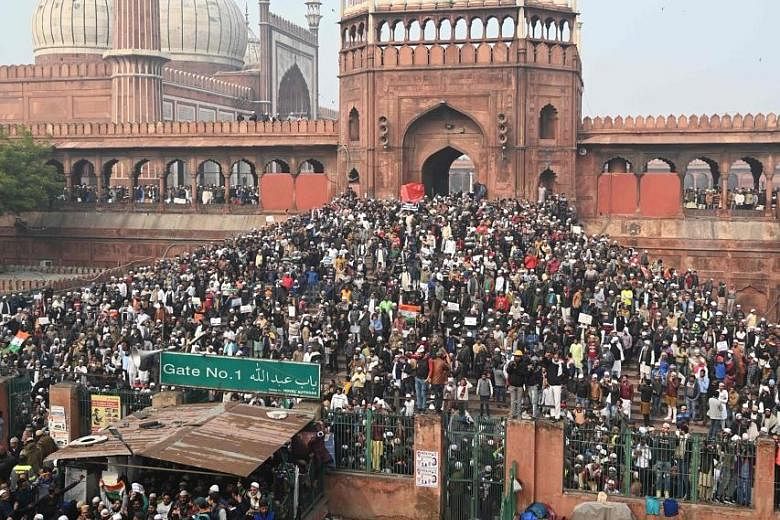 Hundreds of people gathered yesterday at New Delhi's Jama Masjid mosque for a peaceful protest against India's new citizenship law, which is seen as discriminating against Muslims. PHOTO: AGENCE FRANCE-PRESSE