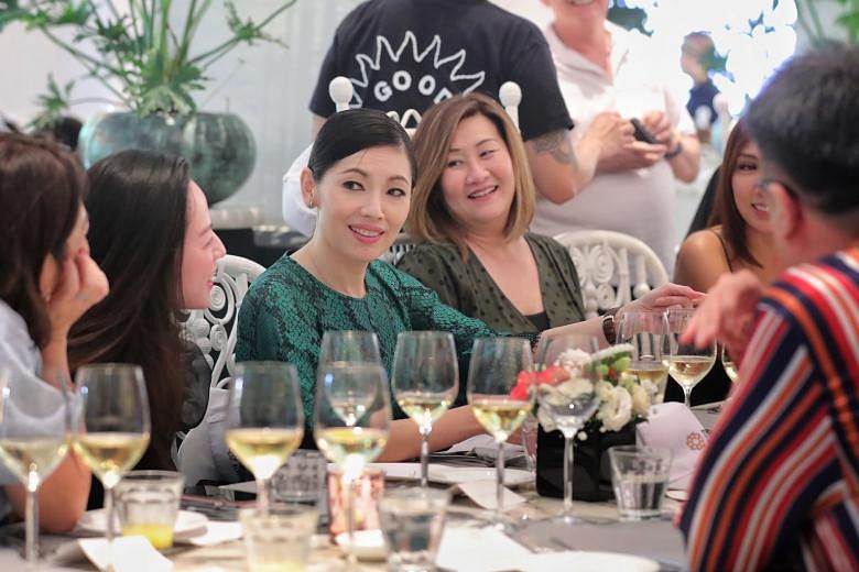 Former Mediacorp actress Sharon Au (in green) at Dempsey Cookhouse for the launch of her online culinary academy. The school is called Ti Yan, which means “experience” in Chinese. 