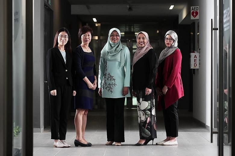 (From far left) Ms Li Jizhi, research assistant at SUSS' Business Intelligence and Analytics unit; Associate Professor Sylvia Chong, project lead of the unit; Mendaki chief executive Rahayu Buang; Mendaki deputy chief executive Aidaroyani Adam; and M