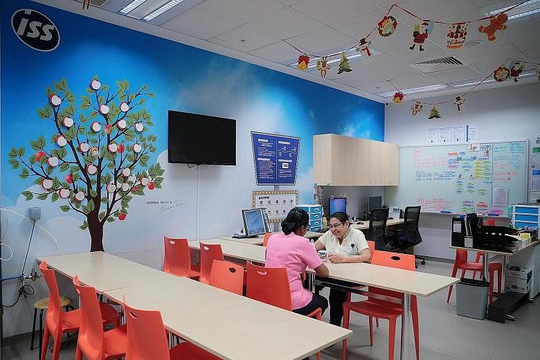 Having clean and well-equipped rest areas for outsourced workers helps to better motivate and retain staff, said cleaning companies that The Sunday Times spoke to. Above: Outsourced workers in the rest area of Academia at Singapore General Hospital. 