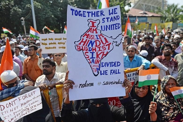 Above: Muslims taking part in a protest against India's new citizenship law in Chennai yesterday. Left: Prime Minister Narendra Modi (fourth from far left) at a rally kick-starting his party's election campaign yesterday in New Delhi, where elections