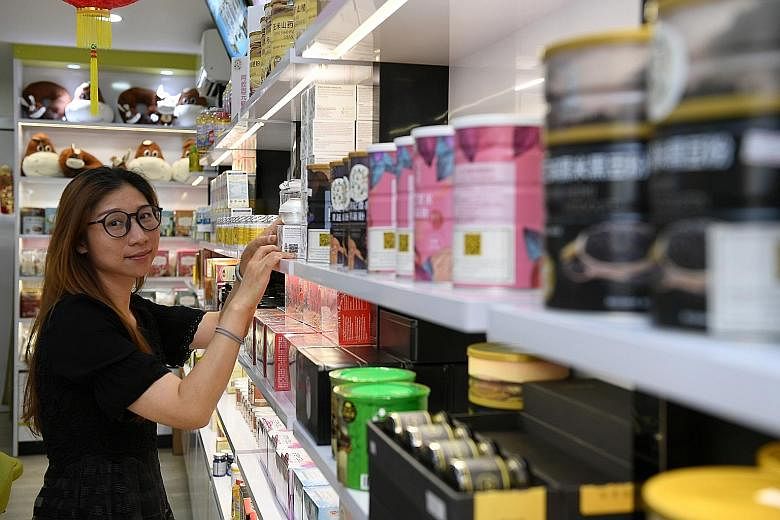 Gu Xiang Yuan director and manager Amy Ho says that since going into e-commerce, her firm's customer base has increased and the online business has seen average monthly growth of 10 per cent.
