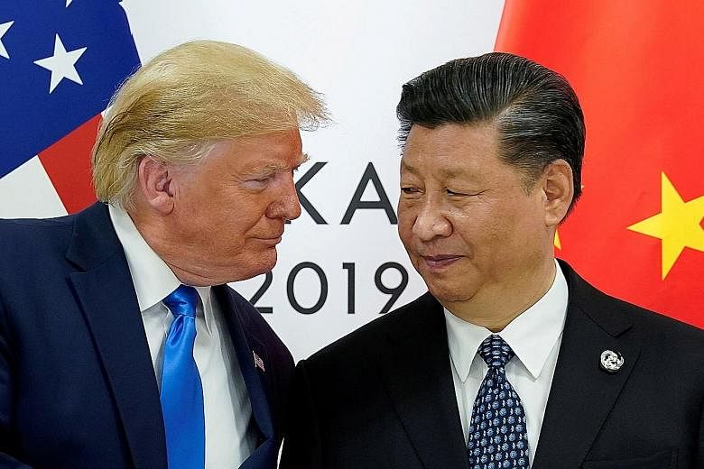 US President Donald Trump with his Chinese counterpart Xi Jinping at the Group of 20 leaders summit in June in Osaka, Japan. PHOTO: REUTERS Huawei's chief financial officer Meng Wanzhou was detained last December by Canada, acting on an extradition r
