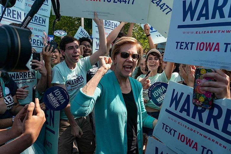 Democratic Senator Elizabeth Warren with her supporters at a campaign rally in Iowa in August. Like other candidates in the US presidential race, she uses music at rallies strategically. PHOTO: AGENCE FRANCE-PRESSE