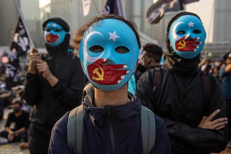 Around 1,000 people attended a rally in Hong Kong yesterday, the first to be specifically in support of China's Uighurs. Many protesters waved the flag of "East Turkestan" - the term many Uighur separatists use for Xinjiang - which has a white cresce