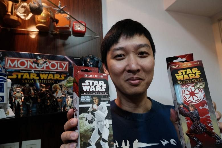 Mr Chen Tao, who runs one of China’s biggest online Star Wars fan groups, with Star Wars collectibles at his home in Shanghai. He is a rare superfan in the country. 