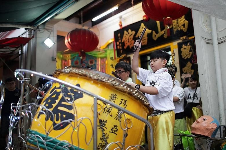 Student Keith Kok, 11, playing the drum during a lion dance performance by the Singapore Hok San Association earlier this month.