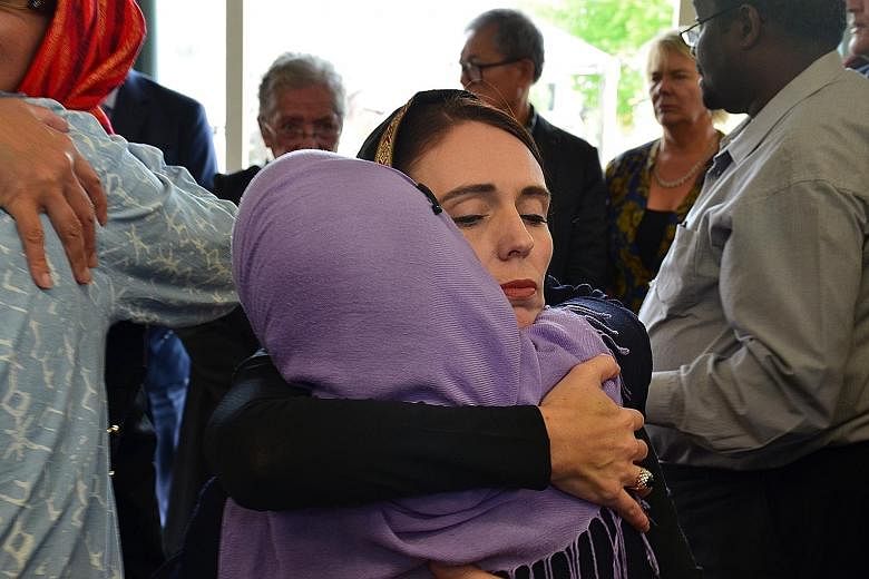 Al Noor Mosque (left) was one of two places in Christchurch targeted by a white supremacist gunman who killed 51 people and injured dozens on March 15. In the wake of the shooting, New Zealand Prime Minister Jacinda Ardern (above) met members of the 