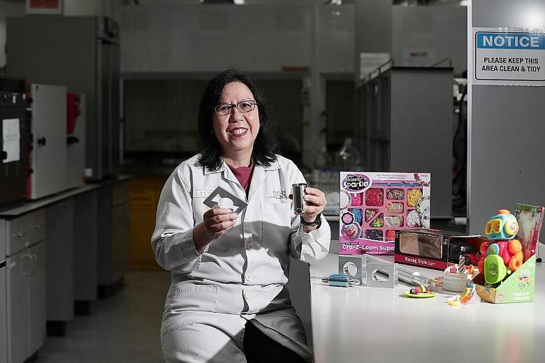 Ms Tham Yoke Chun, manager of the general laboratory at SGS Testing and Control Services Singapore, with some tools she uses for product testing. SGS is one of the labs that partner Enterprise Singapore to test consumer products for compliance with i
