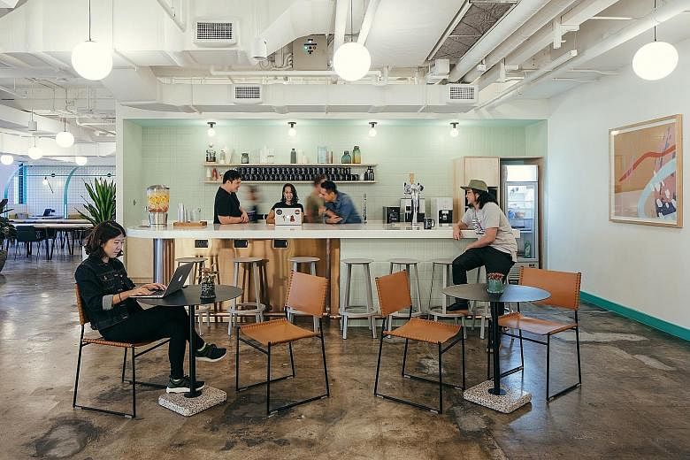 Left: WeWork's co-working space in Beach Road. Since 2015, the co-working sector has grown to more than 200 locations run by about 100 operators, according to Colliers. PHOTO: WEWORK Below: IWG leased over 20,600 sq ft of space at Capitol Singapore e