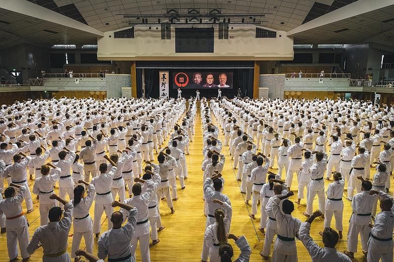 About 1,200 global participants attending the quadrennial Okinawa Traditional Karate Ceremony in August. Okinawa is home to about 400 karate schools and organisations and they help to conduct such events.