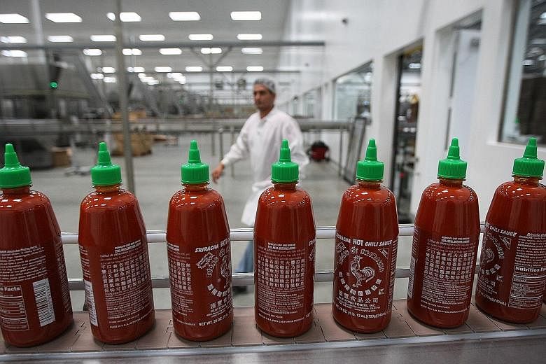 This photograph taken in 2014 shows bottles of Sriracha Hot Chilli Sauce at Huy Fong Foods' California plant.