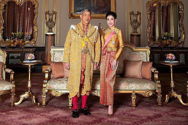 King Maha Vajiralongkorn and Ms Sineenat Wongvajirapakdi in an undated handout from Thailand's Royal Office (above). A trained nurse, bodyguard and pilot (below), Ms Sineenat was named Royal Noble Consort in July but stripped of all her titles on Oct