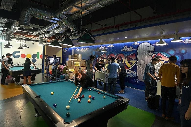 Google employees chilling out at one of the many recreational spaces at its Singapore office. Other perks include free meals and napping pods.
