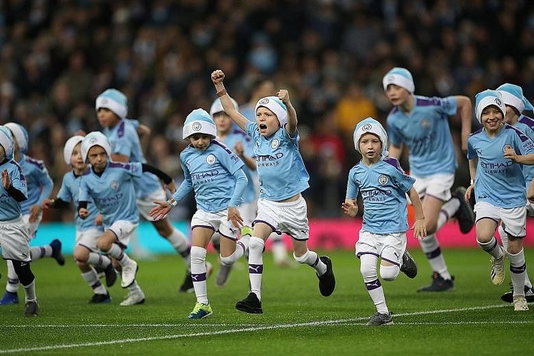 Unlike Manchester City players, the club's mascots, seen here before the Dec 21 Leicester game, were spared Friday's match at Wolves. Suitably refreshed, the mascots will reappear tonight against Sheffield United. PHOTO: REUTERS