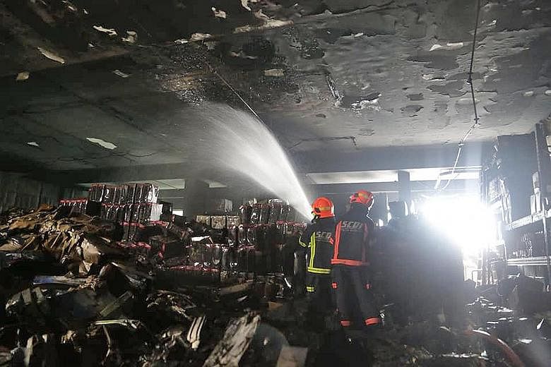 The Singapore Civil Defence Force said yesterday's fire, which broke out at an industrial building at 8 Tagore Drive, involved several items of combustible materials, such as household items and electronic products, in carton boxes. 
