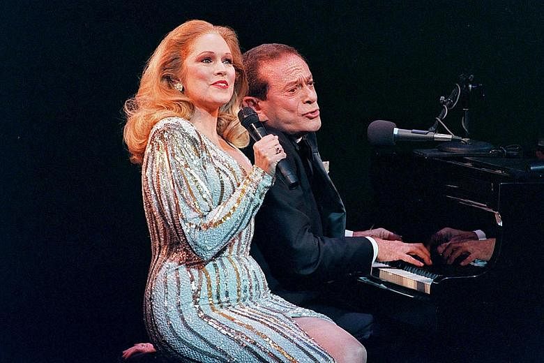 Actress Florence Lacey and composer and lyricist Jerry Herman (both left) performing in An Evening With Jerry Herman in New York in 1998.
