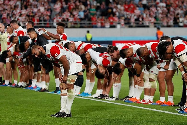 Japan captain Michael Leitch leading his team in thanking the crowd after losing their World Cup quarter-final to eventual champions South Africa. 
