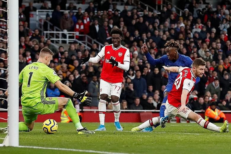 Tammy Abraham shooting through the legs of Arsenal goalkeeper Bernd Leno to complete Chelsea's comeback and earn the visiting team a 2-1 win at the Emirates. The Blues had trailed at half-time to Pierre-Emerick Aubameyang's opener. 