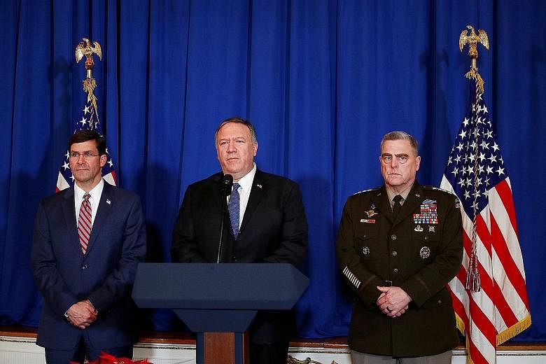 US Secretary of State Mike Pompeo (centre) speaking to reporters about the air strikes, in Palm Beach, Florida, on Sunday. He was flanked by Defence Secretary Mark Esper (far left) and General Mark Milley, chairman of the Joint Chiefs of Staff. PHOTO
