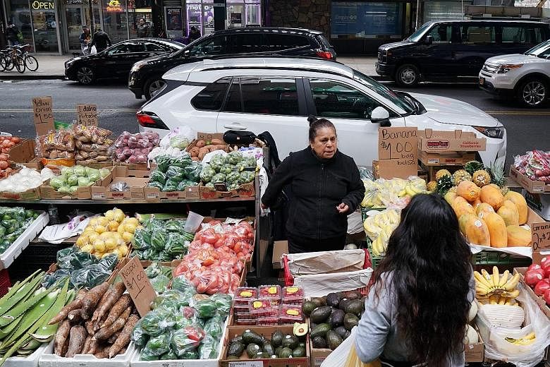 Street vendors in New York City sell a variety of things, from tamales (above) to produce (right). Many of these vendors are undocumented migrants and face a litany of problems while on the job, from bad weather to arrests.