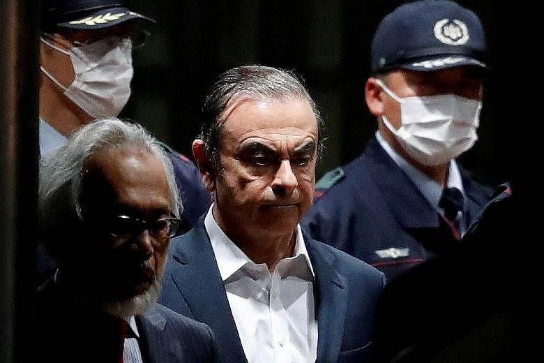 Sacked Nissan chairman Carlos Ghosn leaving the Tokyo Detention House in April last year. He faces four charges - which he denies - including hiding income and enriching himself through payments to dealerships in the Middle East.