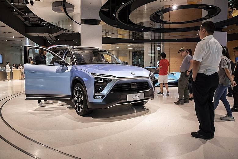 NIO Total debt to total equity: 2,354% WYNN MACAU Total debt to total equity: 1,421% A Nio ES8 vehicle on display in Shanghai in 2018. The Chinese electric vehicle maker is among firms with high leverage in the region. Firms domiciled in Macau such a