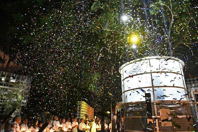 Those who worked on and helped out at The Bicentennial Experience celebrating the end of the show with a bang at its final curtain call on New Year's Eve. ST PHOTO: DESMOND FOO