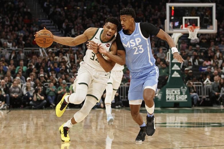 NBA: Giannis Antetokounmpo leads Milwaukee Bucks to narrow win over  Minnesota Timberwolves