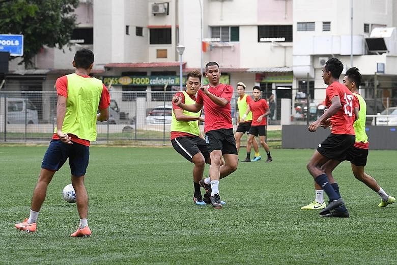 Warriors players training at the Jurong Stadium despite the uncertainties surrounding the team's Singapore Premier League participation next season.