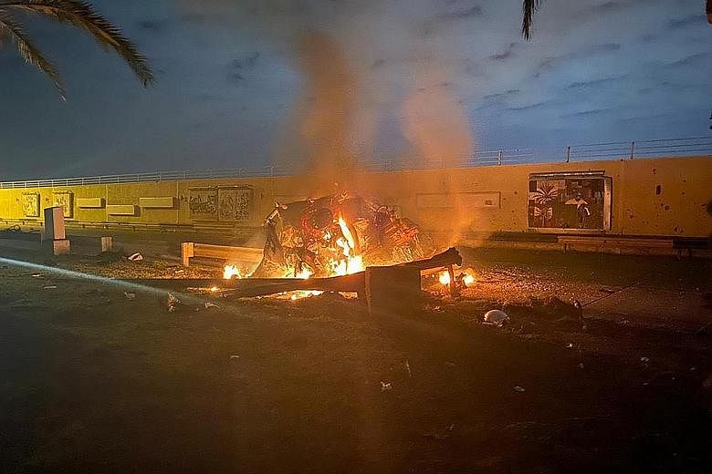 A photo released by the Iraqi Prime Minister Press Office shows a burning vehicle at the Baghdad International Airport following an air strike yesterday. The Pentagon said the US military killed Major-General Qassem Soleimani, commander of Iran's eli