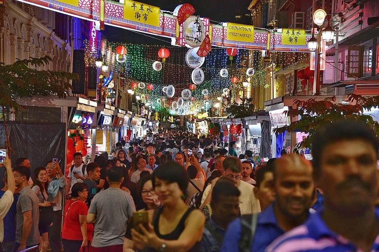 Crowds at the Chinatown night bazaar yesterday. The light-up, which ends on Feb 22, is part of the Chinatown Chinese New Year Celebrations organised by Kreta Ayer-Kim Seng Citizens' Consultative Committee and supported by the Singapore Tourism Board.