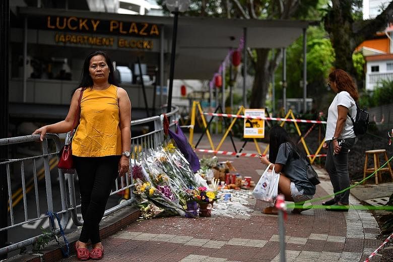 Top: A 2013 photo showing maids at a walkway between Lucky Plaza and Tong Building in Orchard Road. Above: Filipino maid Leonila Incillo near the site of the accident at Lucky Plaza where people have placed flowers in memory of the victims. Madam Inc
