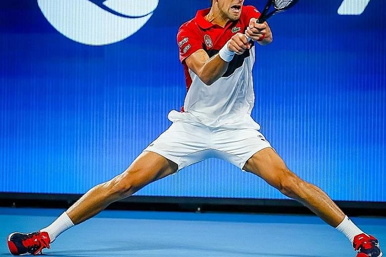 Serbian world No. 2 Novak Djokovic returning to Kevin Anderson of South Africa at the ATP Cup in Brisbane. He was made to work hard, taking both sets on tiebreaks to clinch victory for his team. PHOTO: AGENCE FRANCE-PRESSE