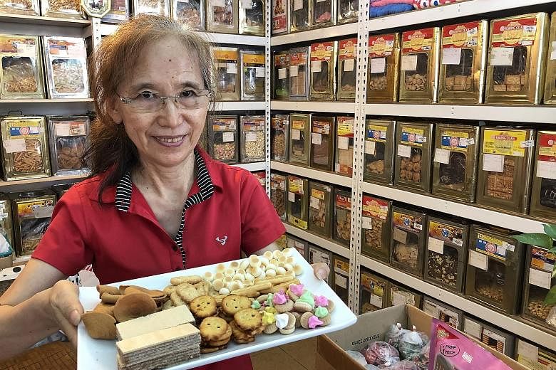 Madam Shen Limin is happy her biscuits remind customers of their childhood. 