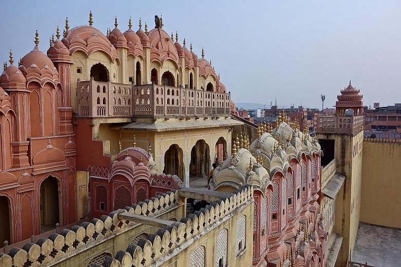 A monkey sitting atop the Hawa Mahal (above), or Palace of Winds, which was previously used by royal ladies to watch processions on the street. The Gudliya Suite (left) in the City Palace is open for bookings via home-sharing site Airbnb. The Bapu Ba