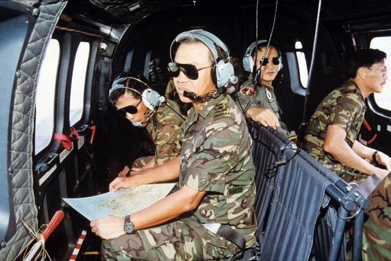  Lt-Gen (Ret) Ng (in front) on board a Super Puma helicopter in 1993 to observe Exercise Wallaby at the Shoalwater Bay Training Area in Australia. 