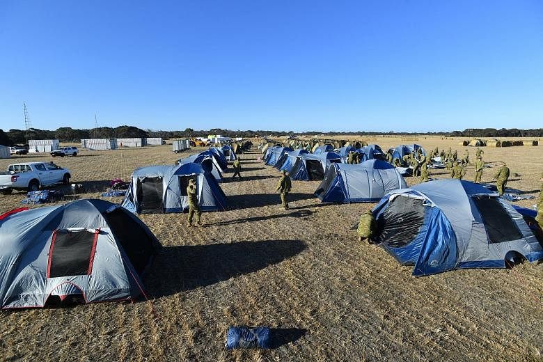 Soldiers setting up camp at Kingscote Airport in Australia's Kangaroo Island on Monday after they were deployed there to help with bush-fire relief.