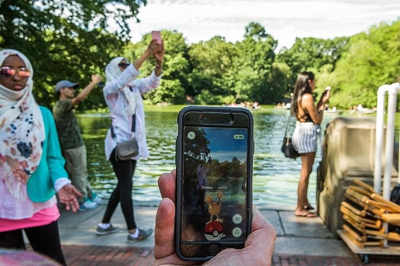 A user playing Pokemon Go - the augmented-reality game which fuses digital technology with the physical world - at New York's Central Park in 2016. After the app was available in Canada, the Canadian Armed Forces issued a public warning, urging civil